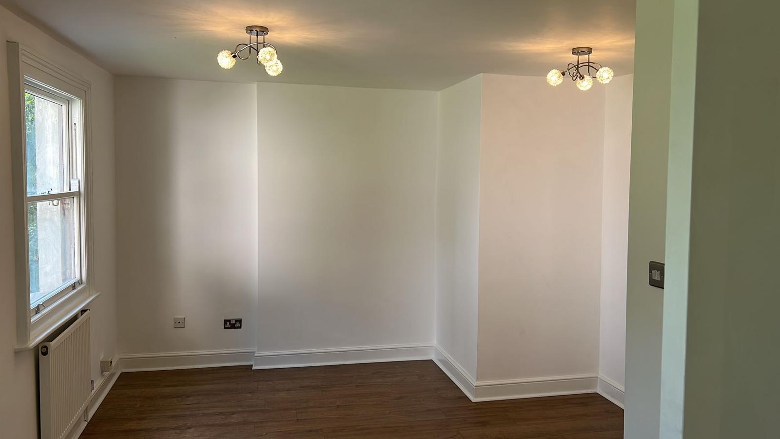 South London Property Renovation Laminate Flooring With White Walls